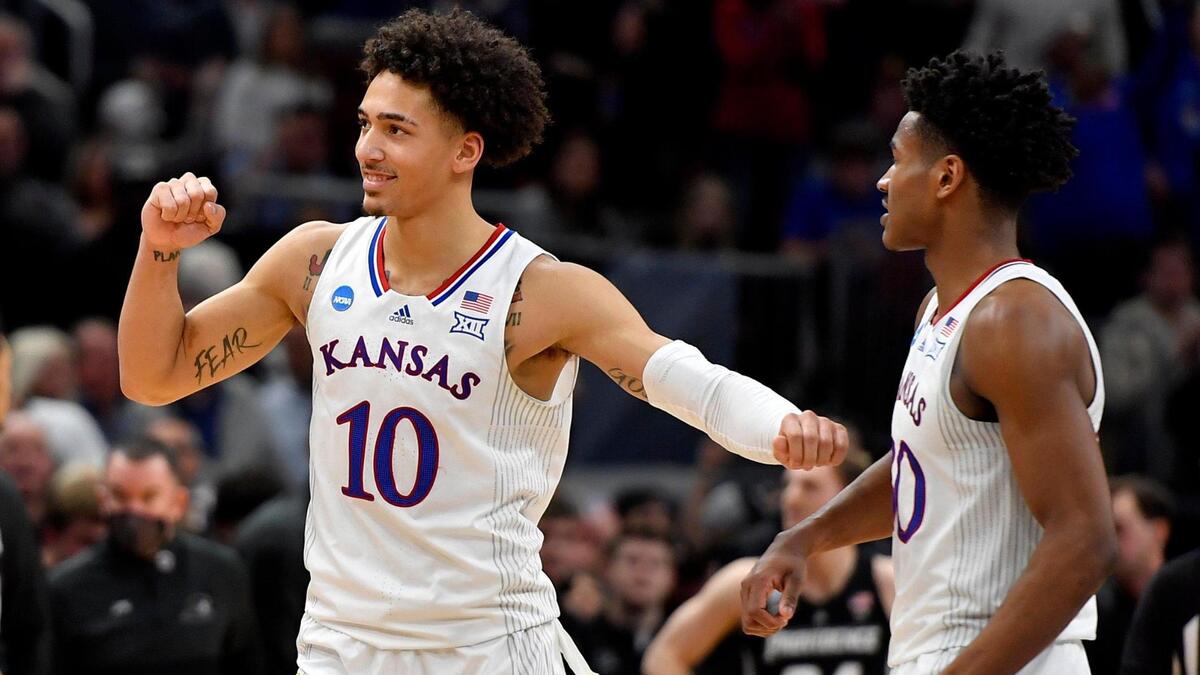 KU basketball’s Jalen Wilson, left, and Ochai Agbaji celebrate their 66-61 win over Providence in the 2022 NCAA Tournament at the United Center in Chicago.